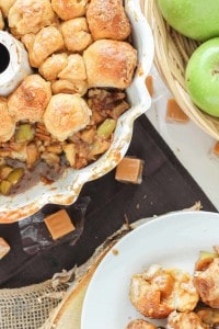 Ooey, Gooey Caramel Apple Monkey Bread is layered with sauteed apples, homemade caramel sauce, cinnamon and pecans. It's a yummy twist on classic monkey bread that'll have you never turning back. | Strawberry Blondie Kitchen