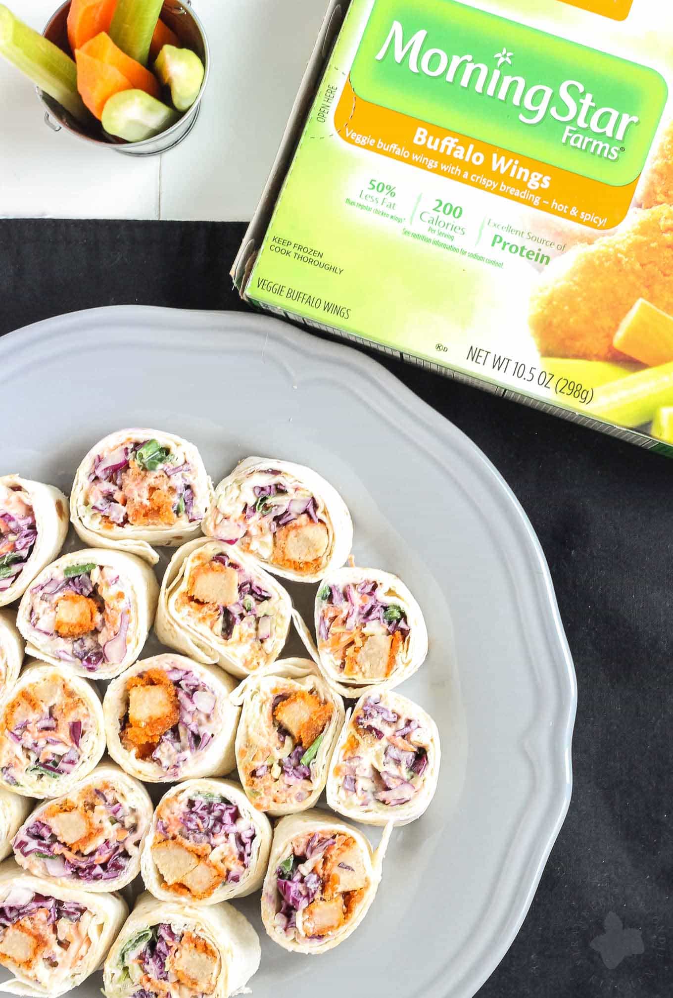 All your favorite flavors of a buffalo wing rolled up into one delicious, snack sized bite in these Buffalo Wing Pinwheels. Made with MorningStar Farms® Buffalo Wings and a blue cheese coleslaw, these are sure to be an all around favorite at your next get together! | Strawberry Blondie Kitchen