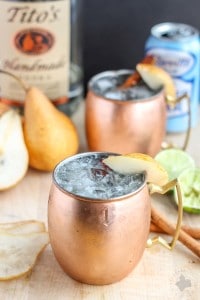 The perfect fall cocktail, this Spiced Pear Moscow Mule features spiced pear simple syrup, vodka, lime and ginger beer. It'll have you enjoying the flavors of Autumn sip after sip. | Strawberry Blondie Kitchen