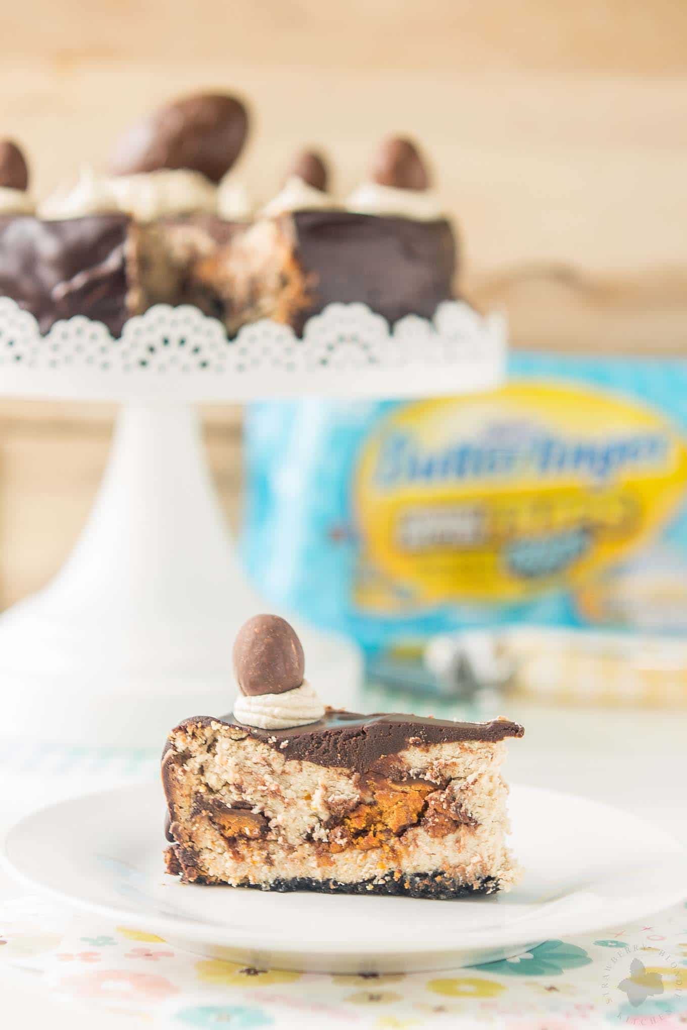 Layers of chocolate cookie crust, peanut butter cheesecake, BUTTERFINGER® Cup Eggs, chocolate ganache and peanut butter frosting, this BUTTERFINGER® Cheesecake Pie is a peanut butter lovers dream! | Strawberry Blondie Kitchen