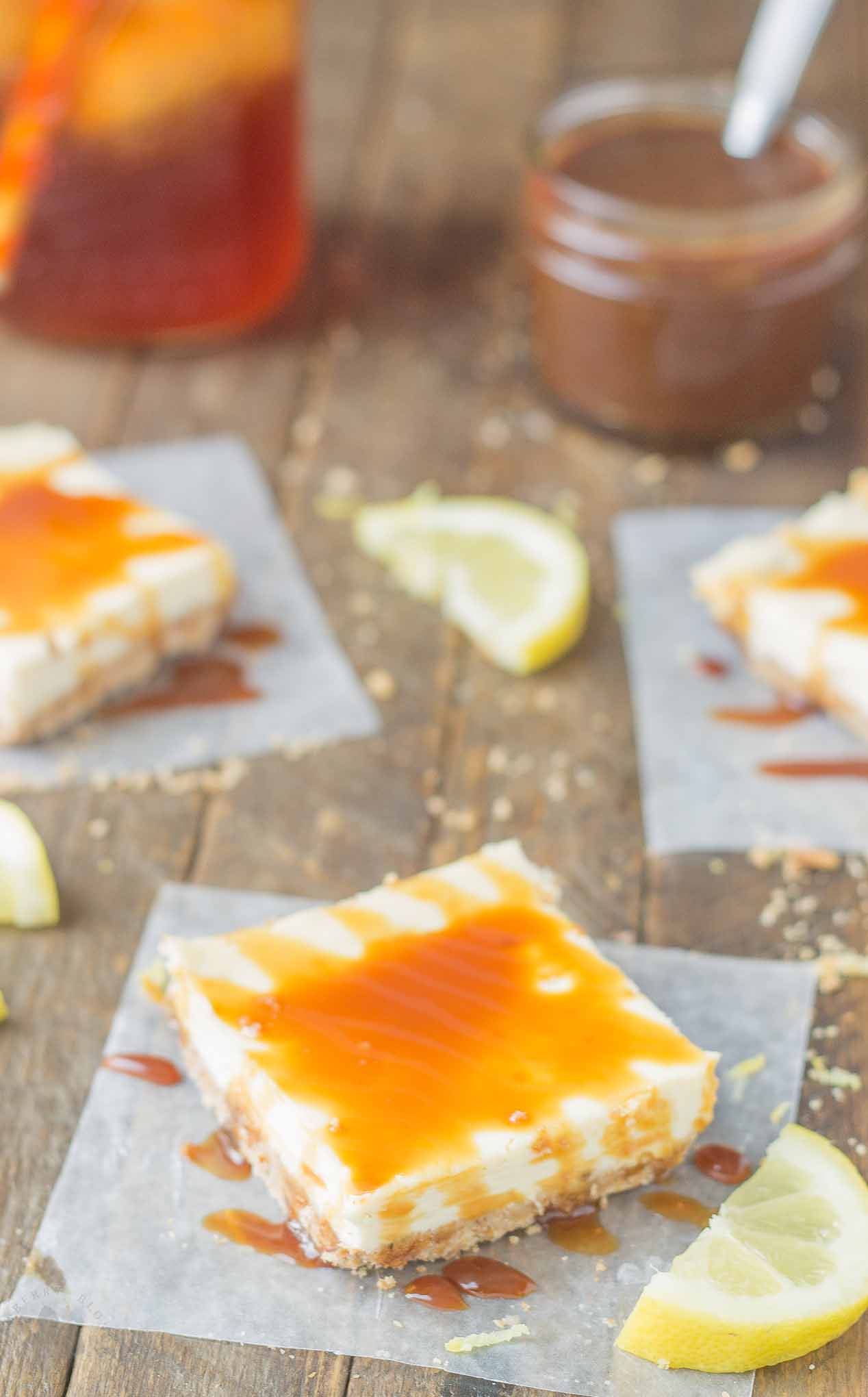 Tangy, tart lemon cheesecake bars are topped with a sweet tea caramel sauce to perfectly marry the two together and create Arnold Palmer Cheesecake Bars. Your favorite way to quench your thirst is now in dessert form! | Strawberry Blondie Kitchen