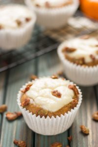 Pumpkin Spice Cream Cheese Muffins are the quintessential treat of Fall. Filled with aromatic autumn spices, stuffed with cream cheese and sprinkled with sugared pepitas, this is sure to be your go to Pumpkin Spice Cream Cheese Muffins recipe. | Strawberry Blondie Kitchen