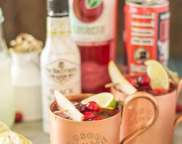 Serve this Cranberry Apple Moscow Mule at your parties this season and you'll always have a full house. Cranberry Apple vodka is crafted with black walnut bitters, ginger beer and lime giving a delicious nutty Fall twist to a classic! | Strawberry Blondie Kitchen