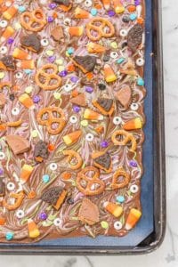 Halloween Candy Bark is a fun and spooky way to bring the deliciousness of Halloween candy into a colorful, no bake bark your whole family can customize. Use Hefty® Slider Bags and cleanup is a breeze! | Strawberry Blondie Kitchen