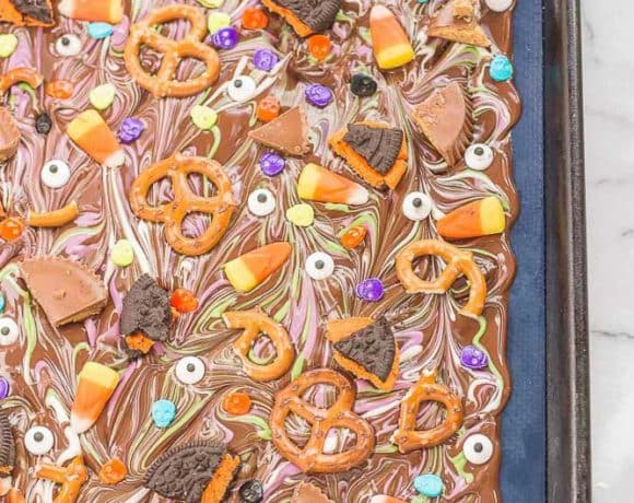 Halloween Candy Bark is a fun and spooky way to bring the deliciousness of Halloween candy into a colorful, no bake bark your whole family can customize. Use Hefty® Slider Bags and cleanup is a breeze! | Strawberry Blondie Kitchen