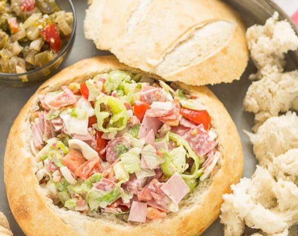 All the classic favorites of an Italian deli sandwich, Meats, cheese, peppers, lettuce and dressing all piled high on top of a baguette make this Chicago Style Hoagie Dip a new game day favorite! | Strawberry Blondie Kitchen