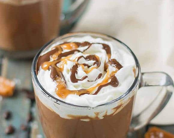 Creamy espresso blends perfectly with chocolate and almond milk, topped with whipped cream, caramel drizzle and a sprinkle of sea salt, making this Sea Salt Caramel Mocha irresistibly delicious! | Strawberry Blondie Kitchen