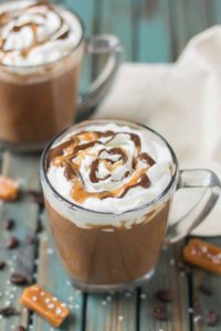 Creamy espresso blends perfectly with chocolate and almond milk, topped with whipped cream, caramel drizzle and a sprinkle of sea salt, making this Sea Salt Caramel Mocha irresistibly delicious! | Strawberry Blondie Kitchen