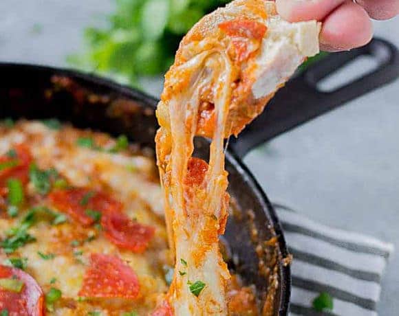 Supreme Pizza Dip is an ooey, gooey, cheesy dip sure to please everyone!  Filled with your favorite pizza toppings, it sure to be a crowd pleaser! | Strawberry Blondie Kitchen