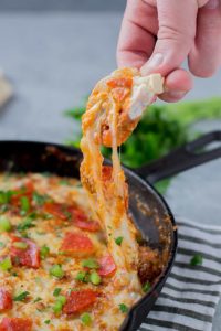 Supreme Pizza Dip is an ooey, gooey, cheesy dip sure to please everyone!  Filled with your favorite pizza toppings, it sure to be a crowd pleaser! | Strawberry Blondie Kitchen
