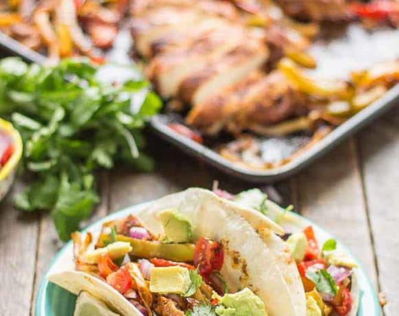 Bursting with flavor and cooked all on ONE pan, these easy Sheet Pan Chicken Fajitas are sure to become permanent in your dinner rotation. You'll love the quick cleanup too! | Strawberry Blondie Kitchen