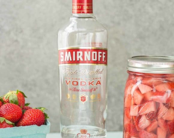 No need to wait for summer to enjoy this delicious and refreshing Strawberry Moscow Mule Float. Made using homemade strawberry vodka and strawberry sorbet, you're sure to love this twist on a classic! | Strawberry Blondie Kitchen