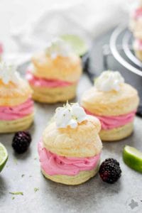 These elegant but simple, Blackberry Lime Buttercream Puffs are sweet, creamy and light. They're filled with a delicious homemade lime curd and fresh blackberry compote. | Strawberry Blondie Kitchen