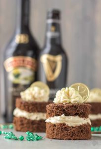 Guinness and Baileys are a match made in Heaven in this Chocolate Guinness Mini Cakes with Baileys Buttercream. It's decadently moist, rich and the perfect ending to your St. Patrick's day festivities. | Strawberry Blondie Kitchen