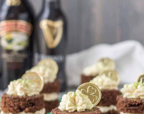 Guinness and Baileys are a match made in Heaven in this Chocolate Guinness Mini Cakes with Baileys Buttercream. It's decadently moist, rich and the perfect ending to your St. Patrick's day festivities. | Strawberry Blondie Kitchen