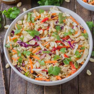 Simple and delicious, this Asian Sesame Noodle Slaw comes together quickly with a little help from P.F. Chang's Sesame sauce for you to be side dish ready in 5 minutes! | Strawberry Blondie Kitchen