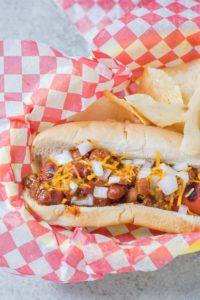 There is something about a hot dog smothered in chili and topped with cheese that has us yearning for the “good ole days.” Take a stroll back to childhood with this Easy Chili Dog. | Strawberry Blondie Kitchen