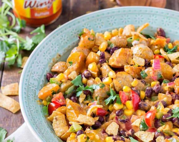 This Mexican Potato Salad is bursting with delicious flavor. Corn, black beans, cherry tomatoes, cilantro and Frank's Redhot Buffalo Wing Sauce make for one amazing side dish for all your summertime gatherings. | Strawberry Blondie Kitchen