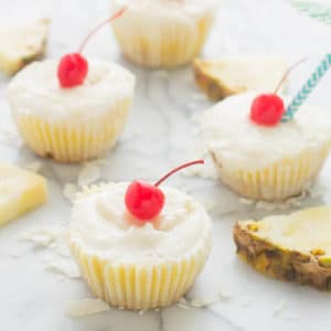 Piña Colada Ice Cream Bites are the perfect treat to cool down this summer. Layers of coconut crust, pureed pineapple and Coconut ProYo High Protein Low Fat Ice Cream make these your new summertime dessert. | Strawberry Blondie Kitchen