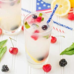Refreshing and delicious, this Spiked Triple Berry Basil Lemonade is a perfect balance of sweet and tart. Smirnoff® Red, White and Berry vodka mixed with tart lemonade and fresh, sweet berries is the ultimate summertime cocktail! | Strawberry Blondie Kitchen