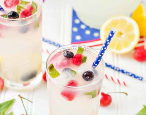 Refreshing and delicious, this Spiked Triple Berry Basil Lemonade is a perfect balance of sweet and tart. Smirnoff® Red, White and Berry vodka mixed with tart lemonade and fresh, sweet berries is the ultimate summertime cocktail! | Strawberry Blondie Kitchen