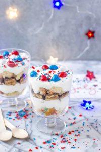 Layers of Pillsbury™ Funfetti® Cake, Frosting, Snickers and M&M’s make these Patriotic Mini Trifles the best way to spread your love of Red, White and Blue! | Strawberry Blondie Kitchen