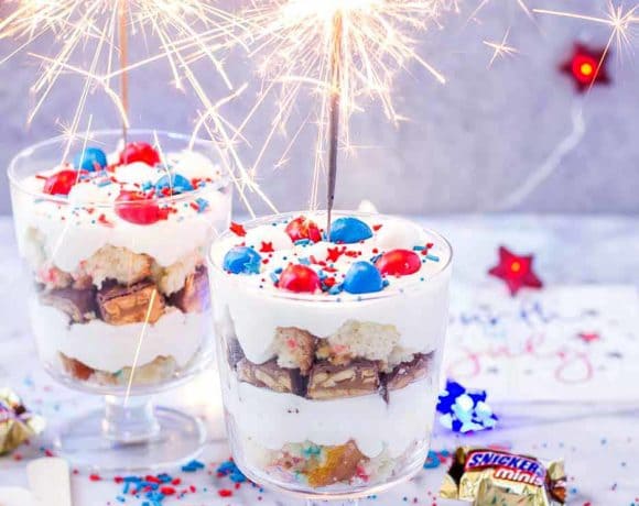Layers of Pillsbury™ Funfetti® Cake, Frosting, Snickers and M&M’s make these Patriotic Mini Trifles the best way to spread your love of Red, White and Blue! | Strawberry Blondie Kitchen