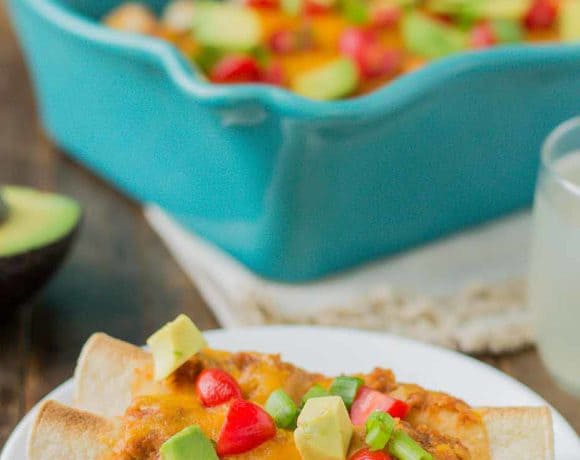 Chipotle Chicken Enchiladas are tasty, filling and come together in a snap thanks to rotisserie chicken and Pop & Cook. Perfect for an easy weeknight meal that is sure to please the whole family! | Strawberry Blondie Kitchen