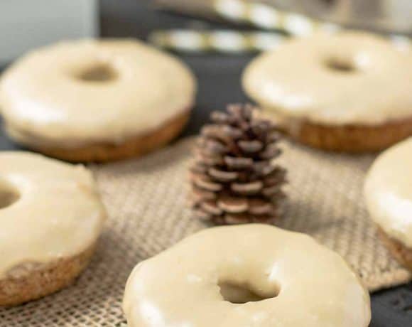 These Apple Cider Donuts with Maple Frosting are perfect on a crisp fall morning with a hot cup of coffee.  They're moist, delicious and bursting with apple and maple flavors. | Strawberry Blondie Kitchen