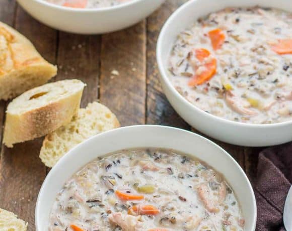 Creamy, delicious and pure comfort food, this healthy Crockpot Chicken and Wild Rice Soup comes together quickly thanks to your slow cooker.  Serve it tonight with some bread for dunking! | Strawberry Blondie Kitchen