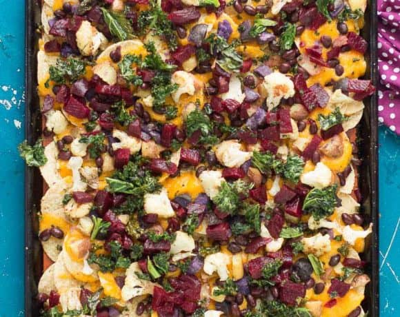 Fall Bounty Sheet Pan Nachos have butternut squash nacho cheese sauce, black beans, kale, roasted cauliflower and beets to give you the ultimate in snacking with all of Fall's delicious produce! | Strawberry Blondie Kitchen