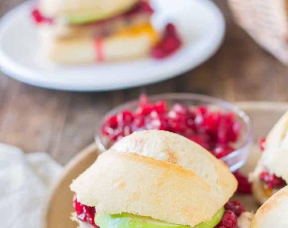 Crispy rolls, smoky turkey and cheese, with tart apples and sweet cranberry sauce come together harmoniously to create these Turkey Cheddar Cran Apple Sliders which are perfect for Thanksgiving leftovers. | Strawberry Blondie Kitchen