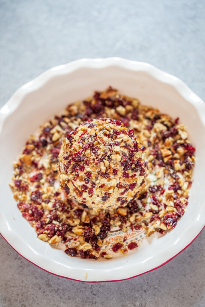 Cranberry Orange Pecan Cheeseball rolled in chopped cranberries and pecans