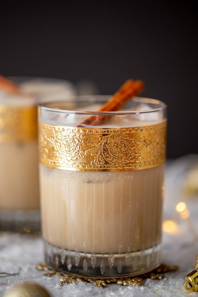 Close up shot of Oatmeal Cookie White Russian cocktail recipe in vintage gold leaf rocks glasses