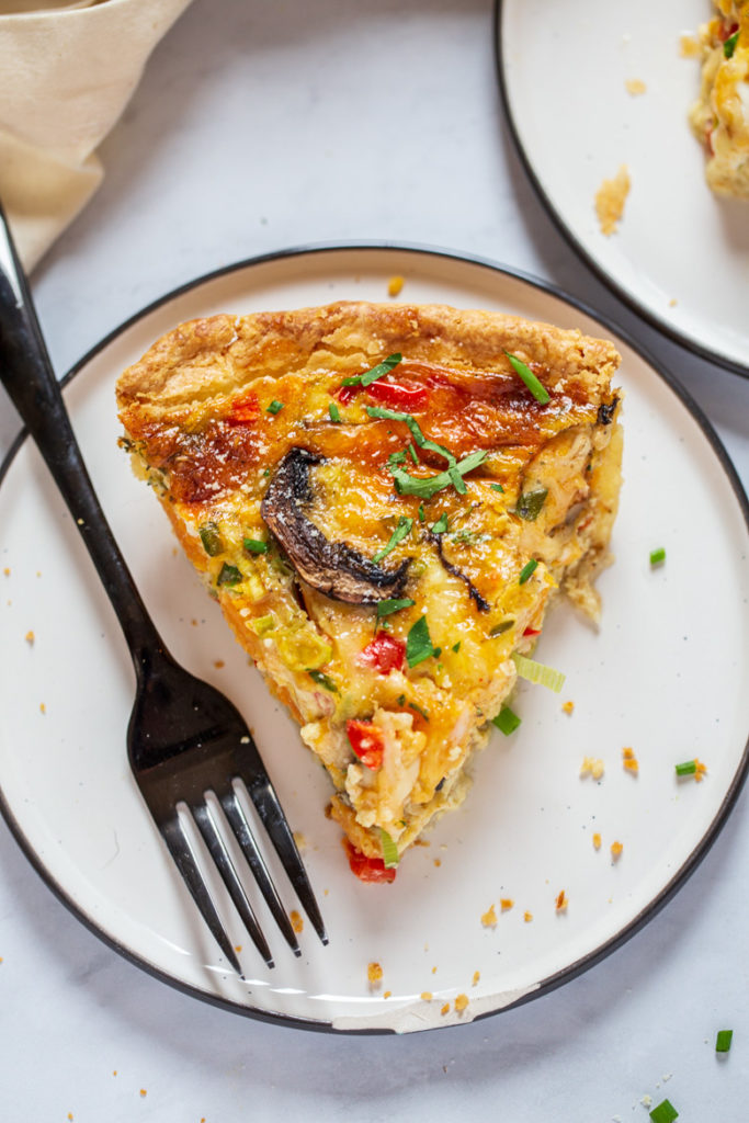 single slice of easy vegetable quiche on a plate