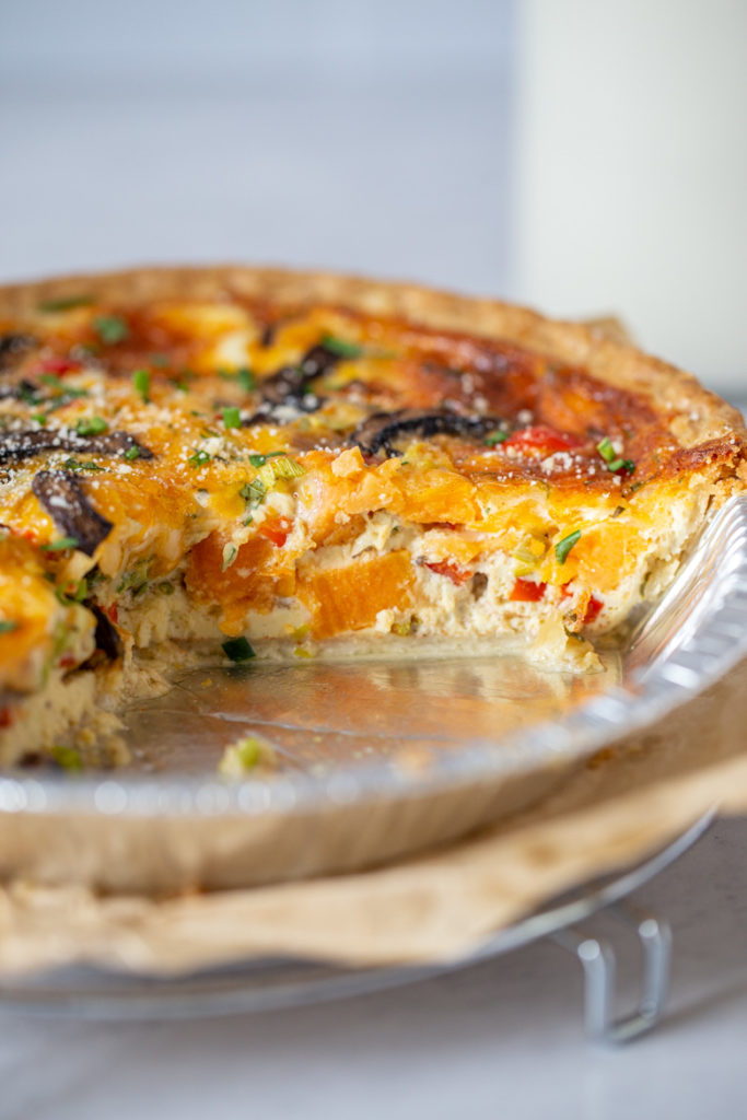 Inside shot showing the filling and all the veggies inside the vegetable quiche 