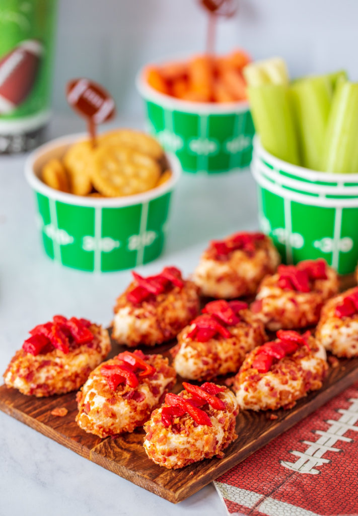 Serving tray full of Horseradish Cheesy Footballs for a superbowl party or game day spread