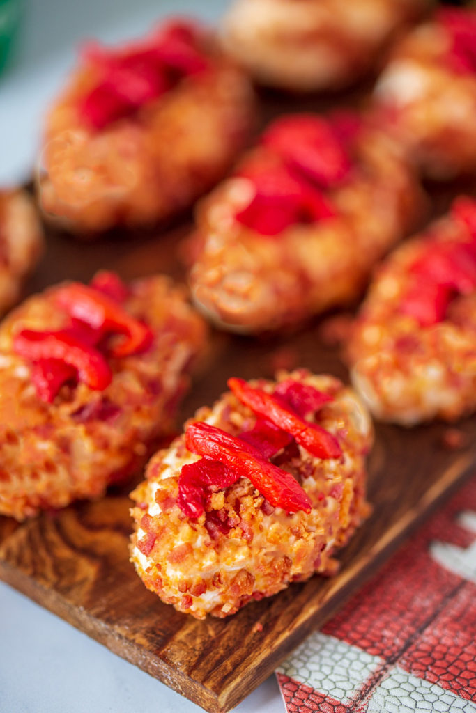 Close up shot of horseradish cheeseball footballs for game day