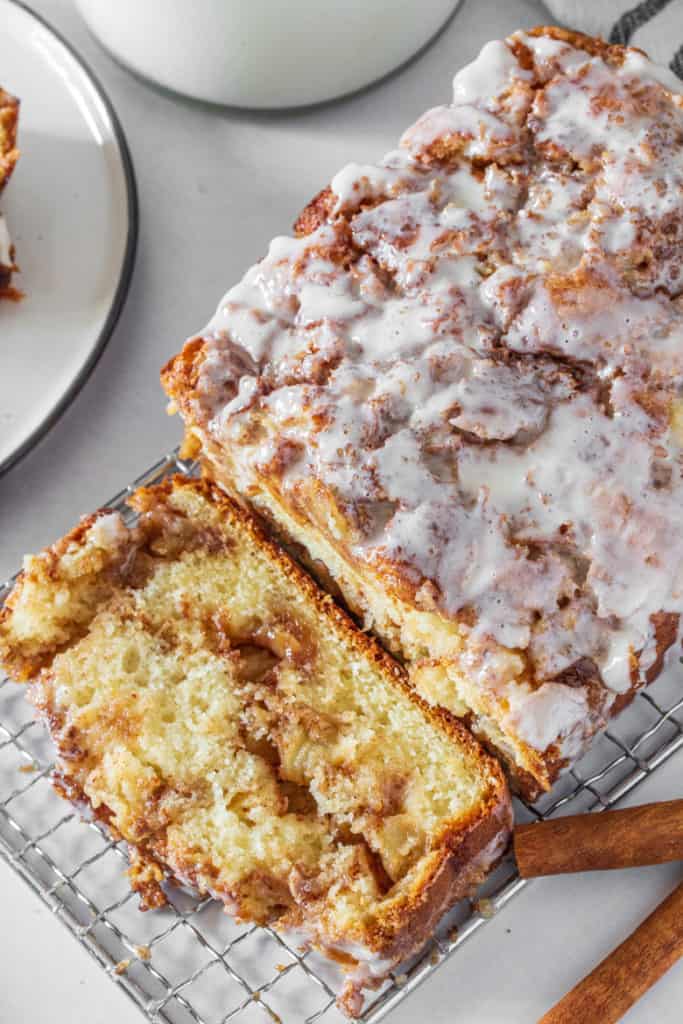 Overhead view of apple fritter bread with one slice