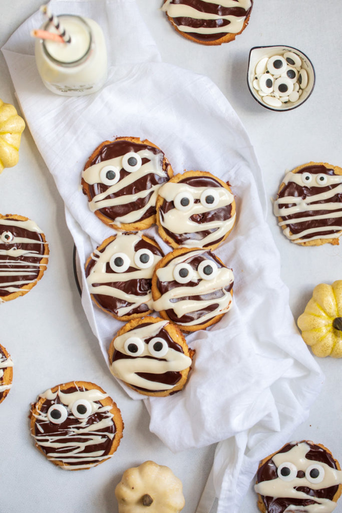 Peanut butter cookies decorated to look like mummies for Halloween
