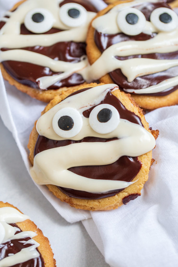 Up close shot of chocolate peanut butter mummy cookies